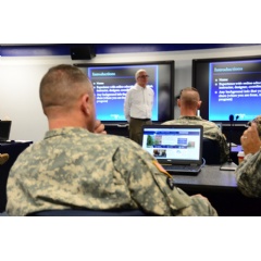 The soldiers in the first class of the U.S. Army Sergeants Major Academy Fellowship program attend an orientation hosted by Penn State adult education professor William Diehl.