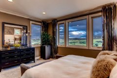 The Umbria models serene master suite looks out on rolling hills and big, Colorado sky.