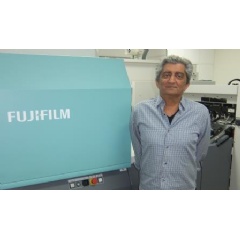 Sam Sowlaty proudly stands next to his Fujifilm J Press 720S, at his Los Angeles, California facility.