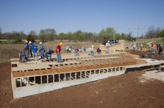 Habitat for Humanity volunteers begin work on one of two homes being built during the RV Care-A-Vanner 25th anniversary celebration in Springfield, Mo