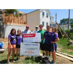 Brothers Chris and Greg Thomas, State Farm agents in New Jersey, present Habitat campus chapters with disaster services grant.