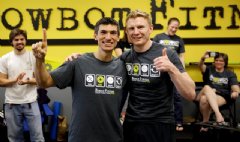 Charles Anderson (left) and Stephen Ebbett (right) celebrate the completion of their World Record Row at Rowbot Fitness on June 1, 2014
