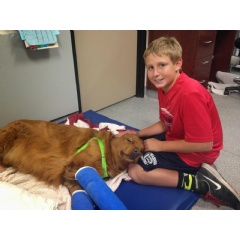 Randall in recovery with his foster boy Ryan at his side.