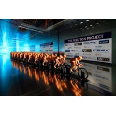 Model cyclists in a peloton formation during wind tunnel testing.