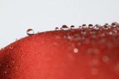 Water forms beads on impregnated materials, an effect that deteriorates with frequent washing. WACKER HC 303 silicone emulsion makes it possible to impregnate fabrics & to restore the water repellency of already impregnated textiles while laundering