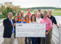 Ken Lane, President of BASFs Catalysts Division (right, front row) and Phil Salerno, President of the Childrens Specialized Hospital Foundation (left, front row) are joined by members of the BASF golf tournament planning committee.