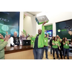 An Xbox fan celebrates being the first to purchase the new Xbox One X console at the flagship Microsoft Store on Fifth Ave. in New York City. (Photo by Mark Von Holden/Invision for Microsoft/AP Images)