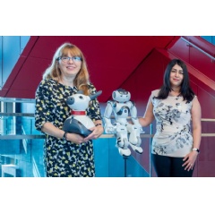University of Waterloo professors Dr. Moojan Ghafurian and Dr. Kerstin Dautenhahn posing with a couple of robots.