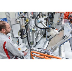 Human-robot cooperation in the assembly of Audi A4/A5 models: Adhesive application with robot assistance, abbreviated from the German as KLARA, provides support with the installation of large CFRP roofs in the new Audi RS 5 Coupe.