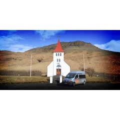 Campervan in front of a church in Iceland