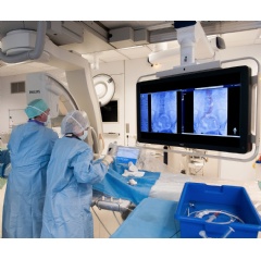 Professor Dr. Frank Vermassen during an image-guided minimally invasive treatment of an aortic aneurysm using VesselNavigator