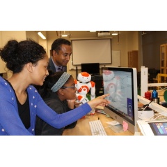A student works in the Choreographe visual programming environment used to program humanoid robots.