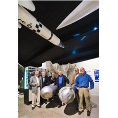 Six active and retired Sandia National Laboratories employees gathered in 2011 at the National Museum of Nuclear Science & History in Albuquerque, NM, around two B28 gravity bombs recovered from a 1966 nuclear accident. (Photo by Randy Montoya)