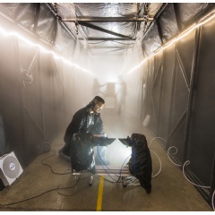 Sandia National Laboratories developed a fog chamber to test optics, like security camera sensors, in a controlled environment. (Photo by Randy Montoya)