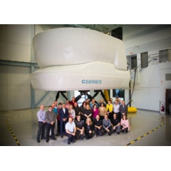 CS100 full-flight simulator and team members