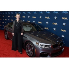BMW partners with the Directors Guild of America for the 69th Annual Directors Guild Awards. Jane Lynch, host of the evening, with the all-new BMW 5 Series Sedan on the red carpet.