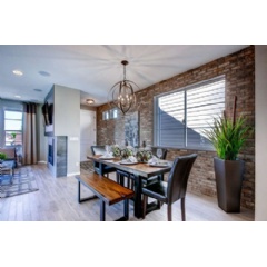 The Bluebird plan is featured as the model home at Park Hill Village and shows a spin on urban living with its industrial chic interior design.