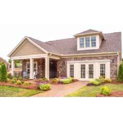 The gorgeous curb appeal and exteriors of this model home, designed by Lita Dirks & Co., are great selling features.