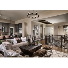 Shot of Berkeley Homes Residence One model home at the Timbers at the Pinery community. These plans feature open living concepts with high vaulted ceilings and connected rooms.