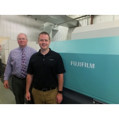 Gary O’Toole, left, General Manager of the Finishing Plant, and Chad Tillery, Pressroom Manager, proudly stand next to their J Press 720S, at Walsworth’s Marceline, Missouri facility.