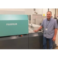 Brian Tilot, VP of Manufacturing, Independent Printing, proudly stands next to the J Press 720S at their De Pere, Wisconsin production facility.