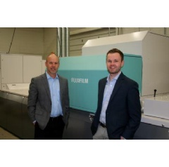 Todd Meissner, left, president, Color Ink, proudly stands next to the J Press 720S, along with his son, Austin, Sales and Sourcing Manager, at their Sussex, Wisc. facility.