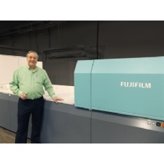 Raymond Ballew, VP of Administration, Floor Productions, proudly stands next to Fujifilm’s J Press 720S, at their Dalton, Georgia facility.
