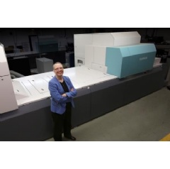 Mardra Sikora, CEO, Pocket Folders Fast, proudly stands next to their two J Press 720S’s, from Fujifilm, at their Omaha, Nebraska facility.