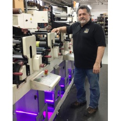 Vincent ’VJ’ Melapioni stands next to a recently converted press featuring Fujifilm’s Illumina LED retrofit system, at his New Jersey-based facility.