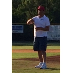 Manager Raul DeCecco throws out the first pitch at the Alexandria Aces last game of the season.