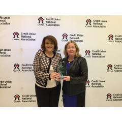CommonWealth Ones President and CEO Charlotte Cash (right) and Chief Marketing Officer Karyle Thornton accept CUNAs first place award.