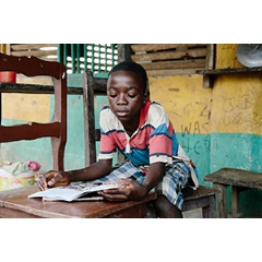 Joshua* is looking forward to returning to school after classes were shut down for months during the Ebola crisis. Photo credit: Aubrey Wade.