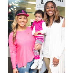 Gospel singer Erica Campbell (left) and celebrity radio host Yolanda Adams (right) helped lift the spirits of 3–year–old St. Jude patient Bella during the eighth annual Radio Cares for St. Jude Kids national broadcast event.