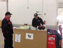 TWI personnel package fresh fruits and vegetables at our Frankfurt distribution facility for delivery to US customers operating in Niger.