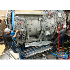 DIII-D personnel complete final checks on a steerable neutral beam injector, one of several new state-of-the-art tools installed during a recently completed facility upgrade Courtesy General Atomics.