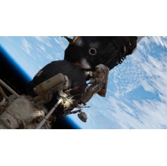 Russian spacewalkers Oleg Kononenko (red stripes suit) and Sergey Prokopyev (blue stripes suit) work outside the International Space Station, more than 250 miles above Earth to inspect the Soyuz MS-09 spacecraft, on Dec. 11, 2018.
-Credit: NASA-