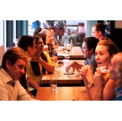 People eat more with friends and family than when dining alone, according to a new study.