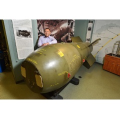 U.S. Air Force Capt. Antonio Gallop, the first Education With Industry student hosted by Sandia National Laboratories, stands next to a Mark 5 bomb display. (Photo by Randy Montoya)