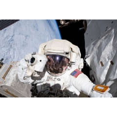 NASA astronaut Andrew Morgan prepares to take a photograph while conducting a spacewalk outside the International Space Station Nov. 22, 2019. Credits: NASA