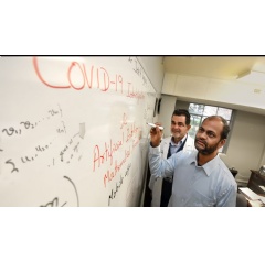 Drs. Arni Rao (foreground) and Jose Vazquez