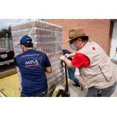 American Red Cross volunteer Jon Strohbehn helps to move water donated by Anheuser-Busch at the Red Cross headquarters in Houston, TX to a truck for MIRA USA. Red Cross photo by Scott Dalton.