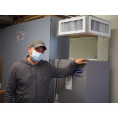 Jorge Rodriguez, custodian at McParland School in Manteca Unified School District, with the district’s first delivered OptiClean unit