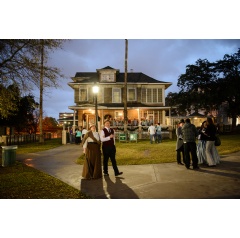 Historical re-enactors stroll the park at the Candlelight Tour, part of the Houston Historical Holiday Weekend event.