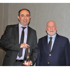 NEO Techs Emilio Ramirez, Vice President of Engineering, receives the technology award during SMTA Expo