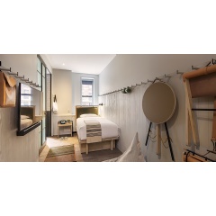 One of the guest rooms at Moxy Times Square, which are designed to be both flexible and functional.