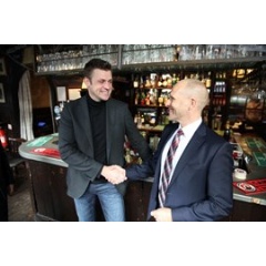 Image of INEOS Automotive CEO, Dirk Heilmann and MB Tech Managing Director Henry Kohlstruck signing the deal in the historic Grenadier Pub, where the idea for Projekt Grenadier first originated.