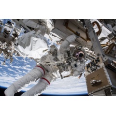 NASA astronaut Drew Feustel seemingly hangs off the International Space Station while conducting a spacewalk with fellow NASA astronaut Ricky Arnold (out of frame) on March 29, 2018.  Credits: NASA
