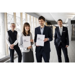 Rüdiger Recknagel, Chief Executive of the Audi Environmental Foundation, (right) and Dean Michael Suda, TUMs Dean of Academic Affairs for Sustainable Resource Management, (left) congratulate the two winners Julia Möbius and Sebastian Heinz.