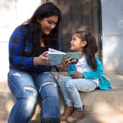 Rosa reads with her daughter, Surena, 4, during a home visit as part of Save the Children’s signature Early Steps to School Success program in Central Valley California. Photo by Tamar Levine for Save the Children.