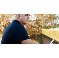 Steve Mills, a commander in the US Navy, uses the Healium AR app on his iPhone at a park in Memphis.